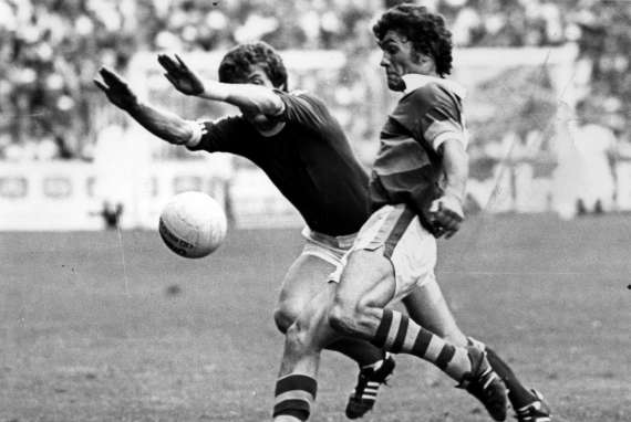 Ger Power challenged by Denny Long in the 1976 Munster Final vs Cork.
