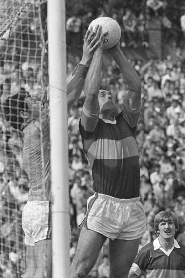 John O'Keeffe claims the ball ahead of Charlie Nelligan in the 1982 Munster Final