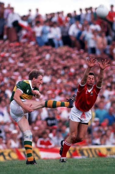 Pat Spillane in action against Anthony Davis of Cork - 1989 Munster Final