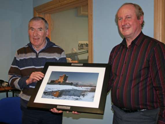 Tadhg Kelleher presenting Weeshie with an image of Ross Castle
