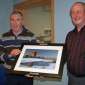 Tadhg Kelleher presenting Weeshie with an image of Ross Castle