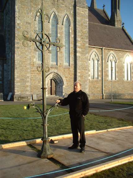 Bishop Murphy with the cross from the top of St Marys Cathedral