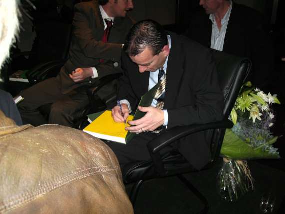 Kerry manager Pat o Shea signs the book for fans